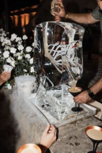 Hand drawn crest as an ice sculpture and Hannah and Dylan's wedding in Paris, France