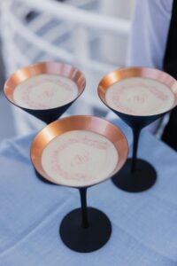 Close up shot of espresso martinis with the custom crest made for Hannah Godwin and Dylan Barbour